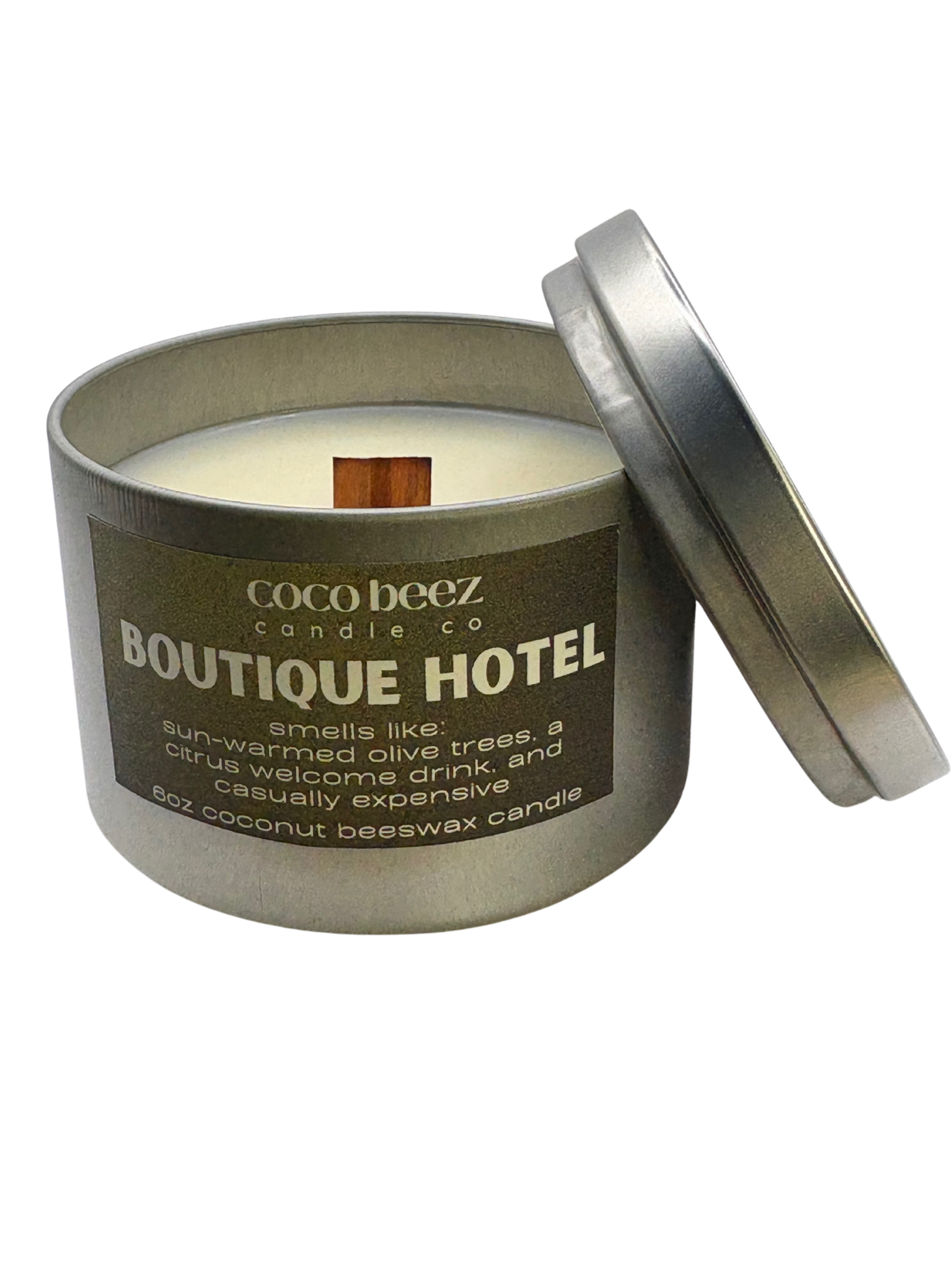 Coco Beez candle in a metal tin labeled 'Boutique Hotel' 