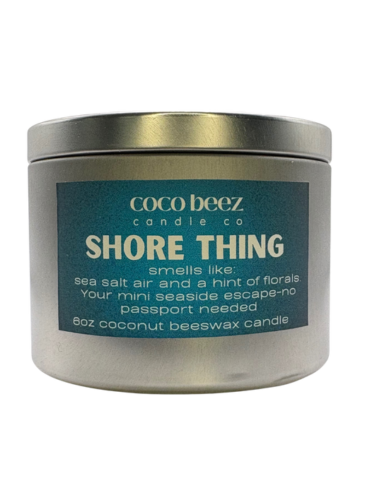 Travel Tin candle with Shore Thing on the label