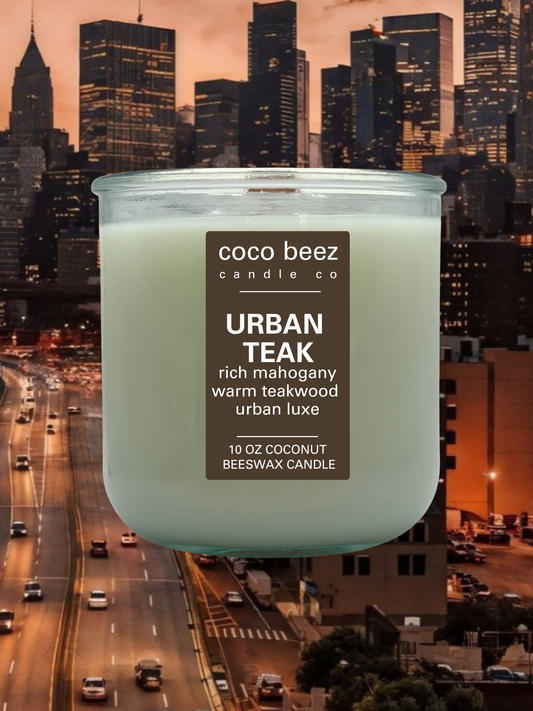 A 10 oz coconut beeswax candle by Coco Beez Candle Co. in a clear glass jar, labeled 'Urban Teak'.