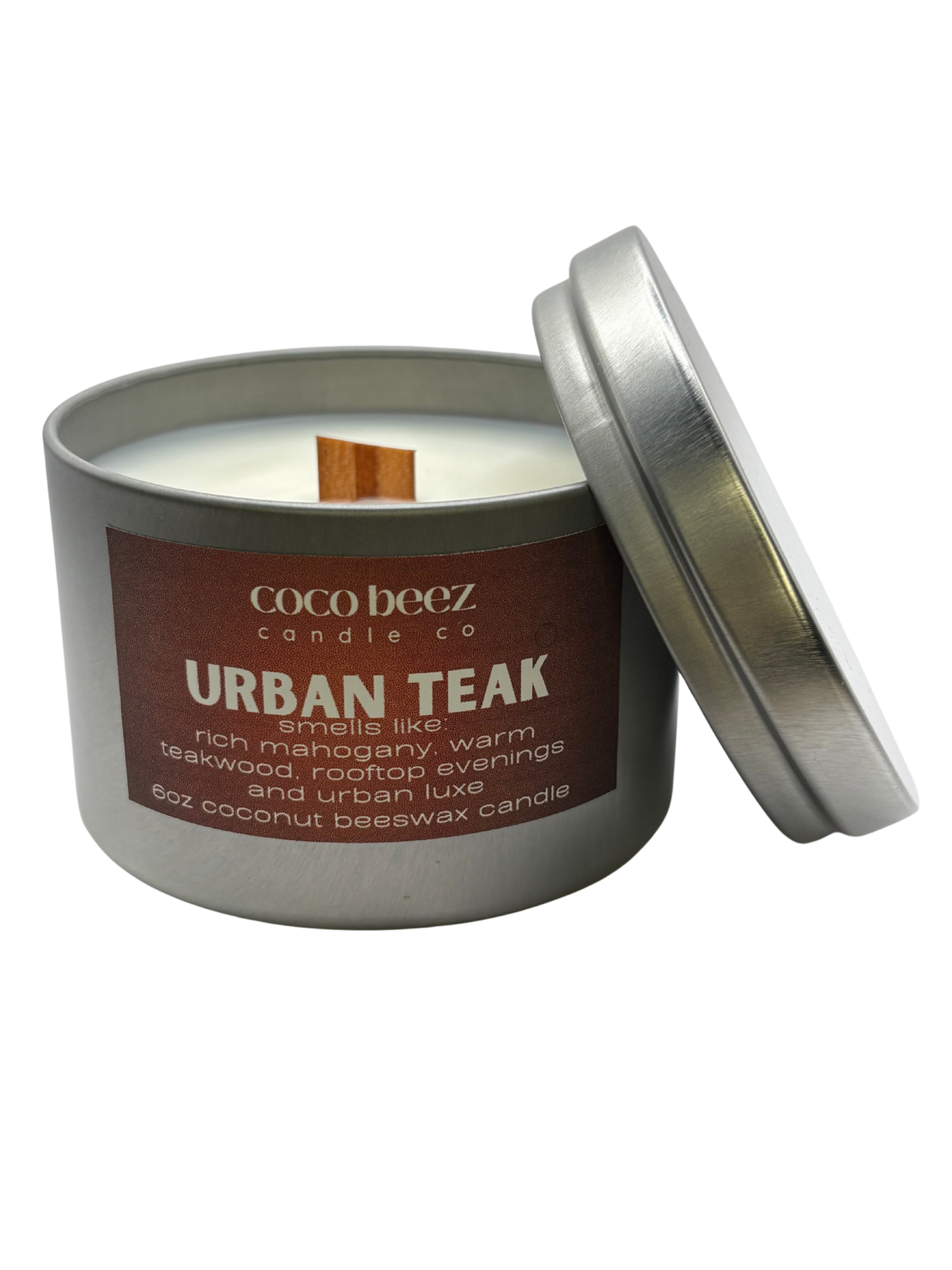 Coco Beez candle in a metal tin labeled 'Urban Teak' 
